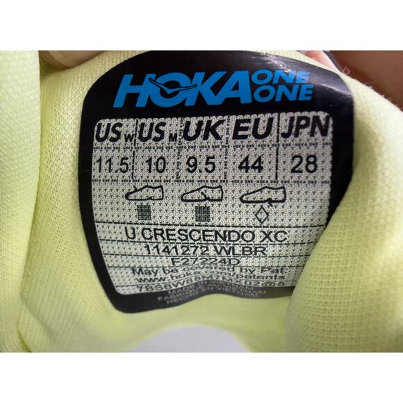 Hoka One One White Athletic Shoe with Blue and Neon Yellow Accents main image 5